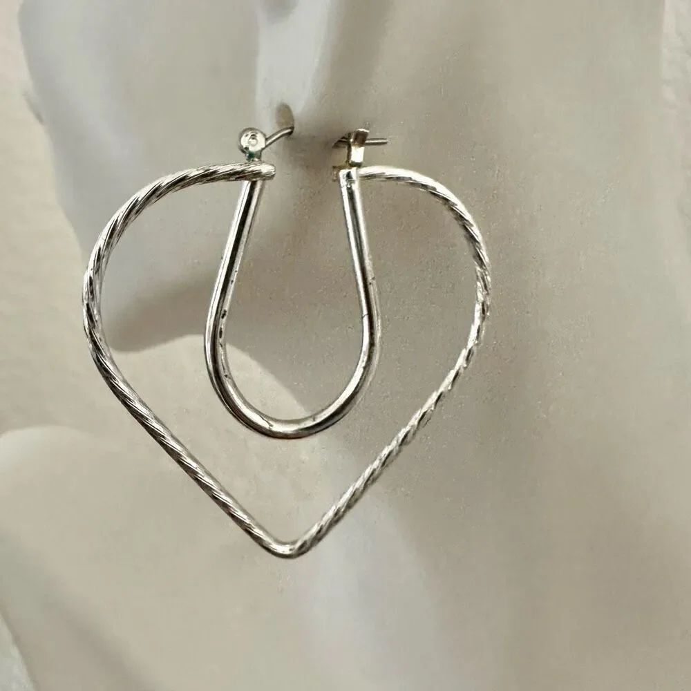 Silver tone cut out heart earrings